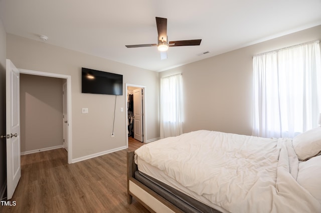 4524 Sweet Williams Ln NW, Wilson, NC 27896 - bedroom featuring a closet, baseboards, visible vents, wood finished floors, and a spacious closet