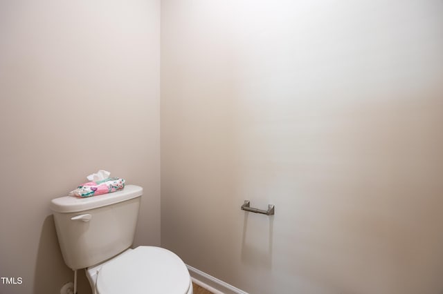 4524 Sweet Williams Ln NW, Wilson, NC 27896 - bathroom featuring toilet and baseboards