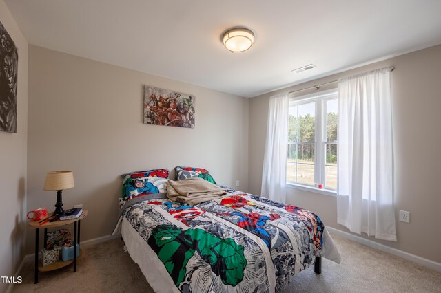 4524 Sweet Williams Ln NW, Wilson, NC 27896 - bedroom featuring carpet flooring, visible vents, and baseboards