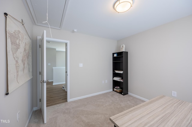 4524 Sweet Williams Ln NW, Wilson, NC 27896 - unfurnished bedroom with attic access, light carpet, and baseboards