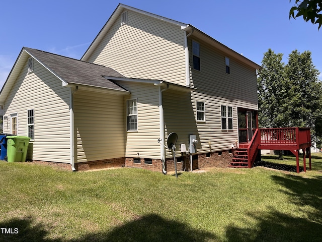 back of property featuring a lawn, a deck, and crawl space