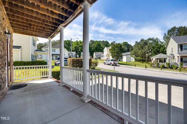 balcony with a residential view and a porch