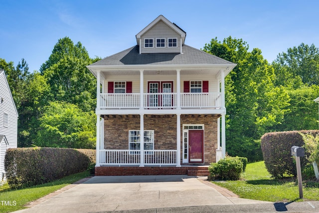 view of front facade featuring a porch and stone siding