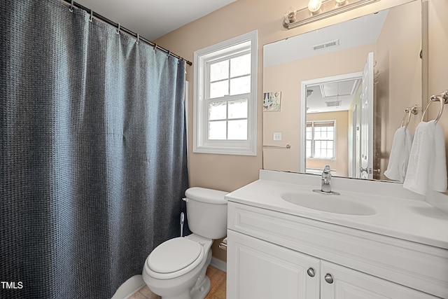 full bathroom with toilet and vanity