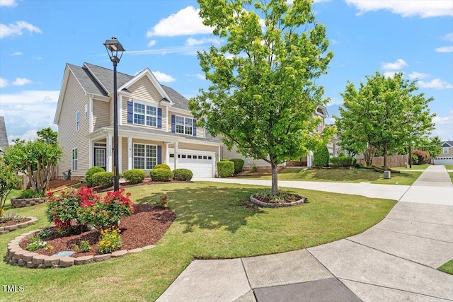 view of front of home featuring concrete driveway, a front lawn, and a garage