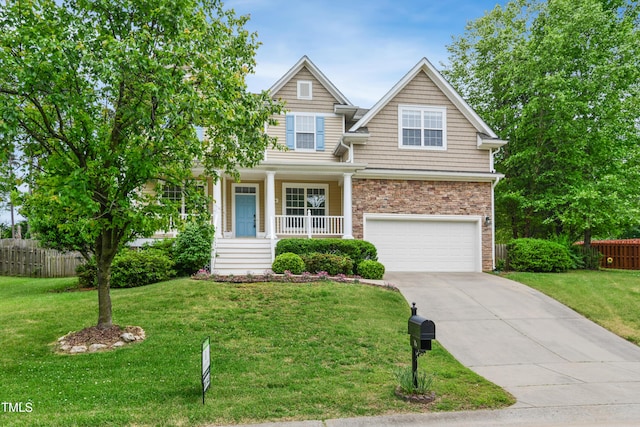 view of front of home with an attached garage, concrete driveway, and a porch