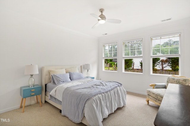bedroom featuring crown molding, multiple windows, baseboards, and light colored carpet