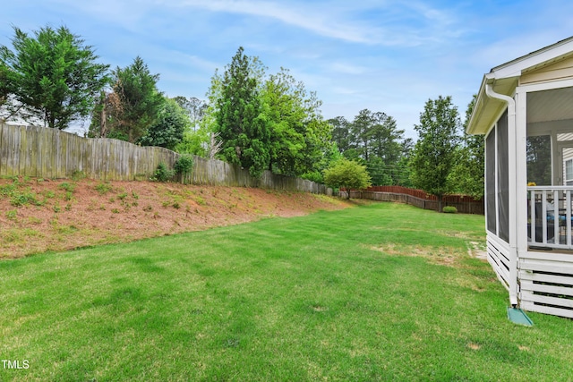 view of yard with a sunroom