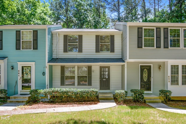 view of front of house with a shingled roof and covered porch