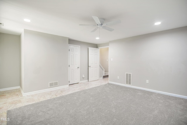 spare room featuring a ceiling fan, recessed lighting, baseboards, and carpet floors