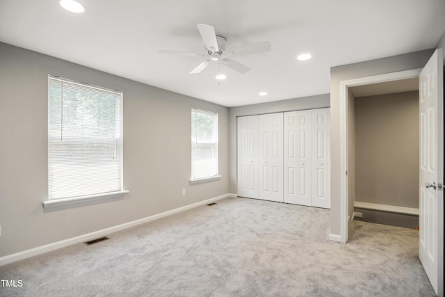 unfurnished bedroom featuring carpet flooring, recessed lighting, a closet, baseboards, and ceiling fan