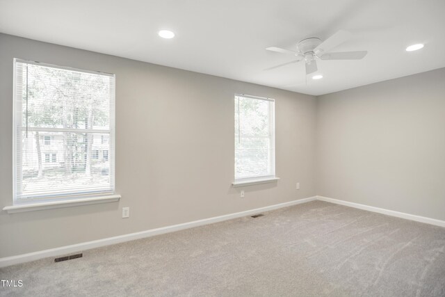 carpeted empty room featuring baseboards, recessed lighting, and ceiling fan