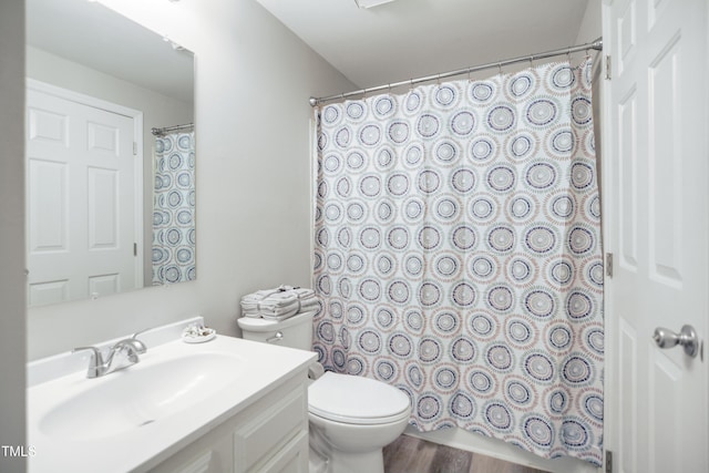 full bath with toilet, curtained shower, vanity, and wood finished floors
