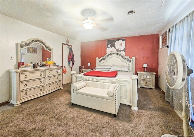 bedroom with a textured ceiling, ceiling fan, and carpet floors