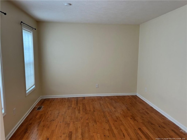 1901 Ellie Ave, Fayetteville, NC 28314 - spare room featuring wood finished floors and baseboards