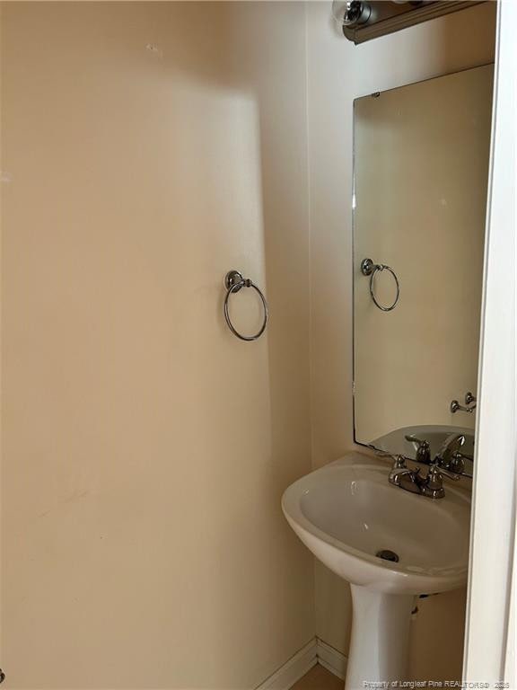 1901 Ellie Ave, Fayetteville, NC 28314 - bathroom with a sink and baseboards