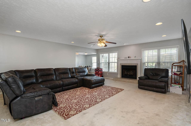 living room with a fireplace, carpet flooring, a ceiling fan, and recessed lighting