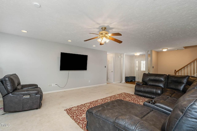 living area with stairs, recessed lighting, ceiling fan, carpet flooring, and baseboards