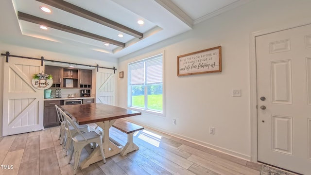 2912 Epps Clark Rd, Siler City, NC 27344 - dining space featuring a barn door, light wood-type flooring, a raised ceiling, baseboards, and recessed lighting