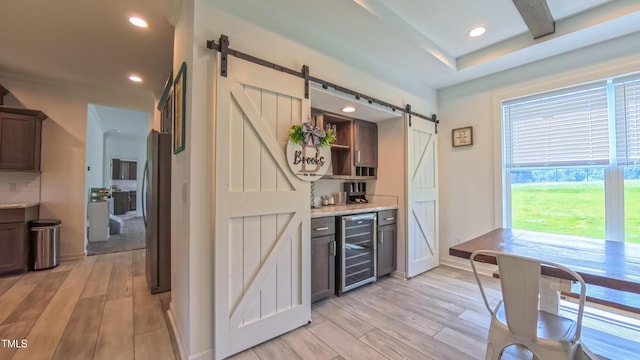 2912 Epps Clark Rd, Siler City, NC 27344 - bar area with a barn door, beverage cooler, freestanding refrigerator, light wood-style flooring, and recessed lighting