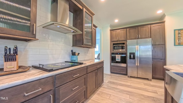 2912 Epps Clark Rd, Siler City, NC 27344 - kitchen featuring stainless steel appliances, wall chimney exhaust hood, light wood finished floors, tasteful backsplash, and recessed lighting