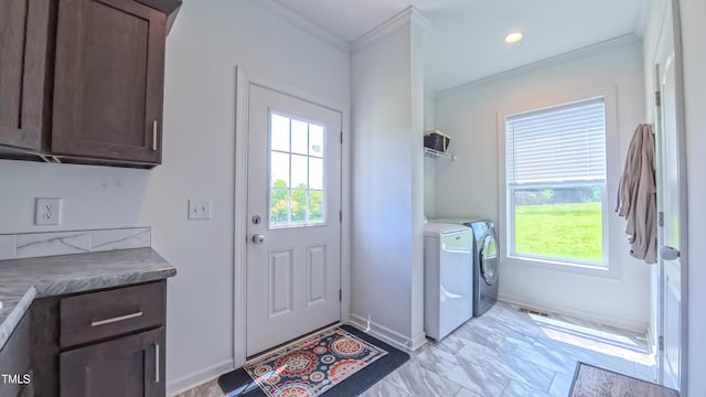 2912 Epps Clark Rd, Siler City, NC 27344 - entryway featuring washing machine and clothes dryer, ornamental molding, healthy amount of natural light, light marble finish floors, and baseboards