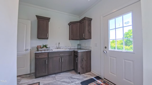 2912 Epps Clark Rd, Siler City, NC 27344 - kitchen with a sink, ornamental molding, light marble finish floors, light countertops, and dark brown cabinets