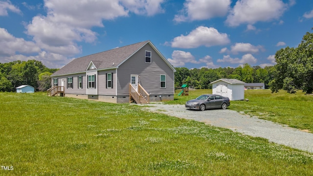 2912 Epps Clark Rd, Siler City, NC 27344 - view of home's exterior featuring a shed, crawl space, an outdoor structure, and a shingled roof