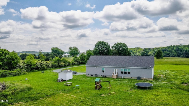 2912 Epps Clark Rd, Siler City, NC 27344 - back of property featuring a trampoline, a yard, crawl space, an outbuilding, and entry steps
