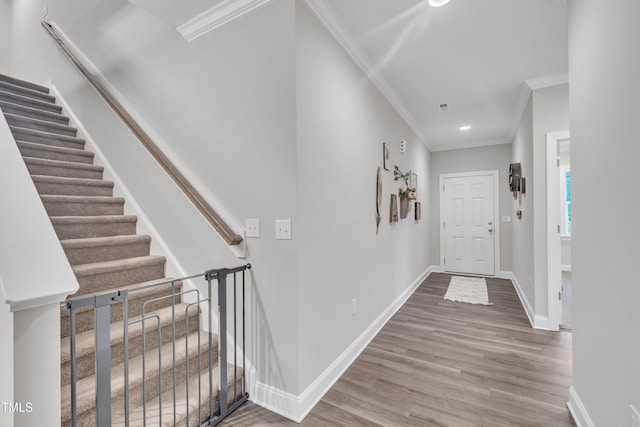 9 Little Sunshine Brk, Smithfield, NC 27577 - hallway featuring ornamental molding, wood finished floors, stairs, baseboards, and recessed lighting