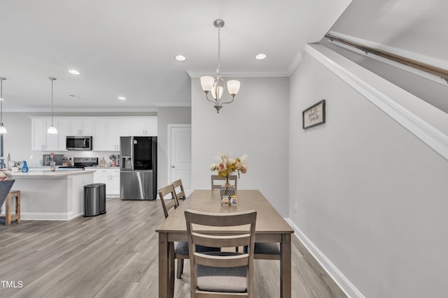 9 Little Sunshine Brk, Smithfield, NC 27577 - dining space with crown molding, light wood finished floors, recessed lighting, a chandelier, and baseboards