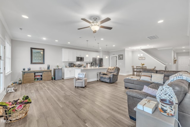 9 Little Sunshine Brk, Smithfield, NC 27577 - living room featuring ornamental molding, recessed lighting, ceiling fan, light wood finished floors, and baseboards