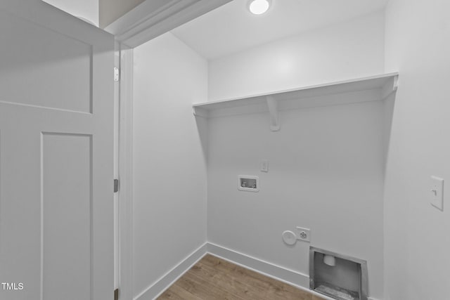 laundry area featuring baseboards, hookup for a washing machine, hookup for a gas dryer, wood finished floors, and laundry area