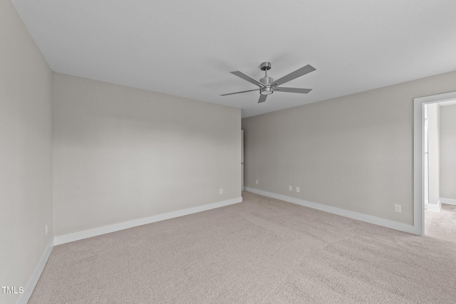 unfurnished room with ceiling fan, carpet floors, and baseboards