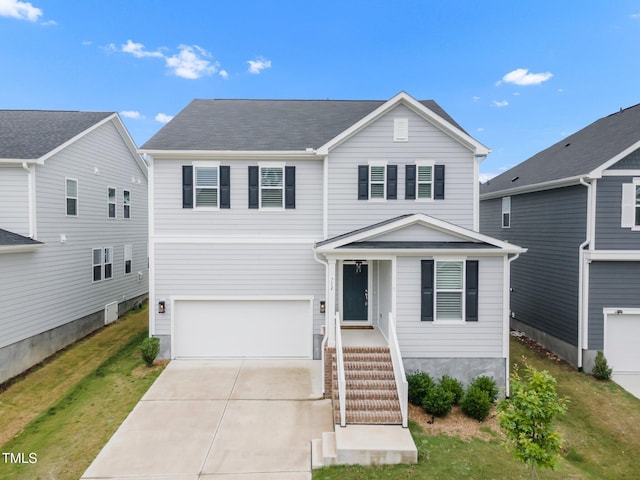 712 Emmer St, Rolesville, NC 27571 - traditional-style home with a garage, driveway, and a front yard