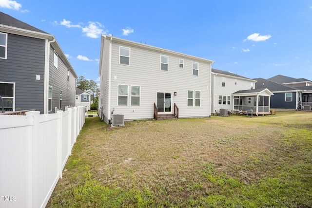 712 Emmer St, Rolesville, NC 27571 - rear view of house with central AC, entry steps, and a sunroom