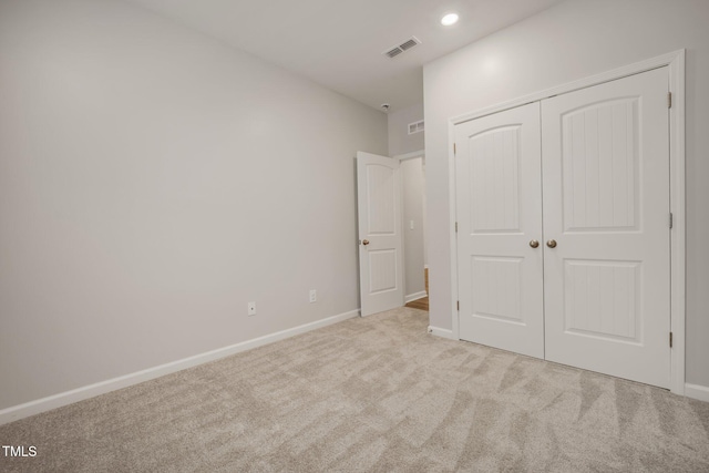 712 Emmer St, Rolesville, NC 27571 - unfurnished bedroom with carpet flooring, a closet, baseboards, and recessed lighting