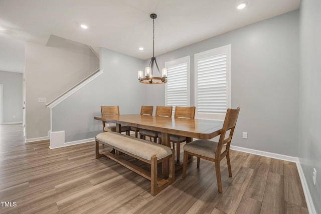 712 Emmer St, Rolesville, NC 27571 - dining room featuring stairs, a chandelier, light wood finished floors, baseboards, and recessed lighting