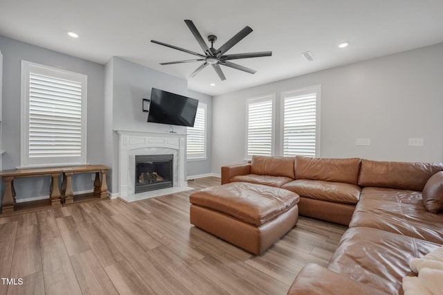 712 Emmer St, Rolesville, NC 27571 - living area with light wood-type flooring, a ceiling fan, a fireplace, recessed lighting, and baseboards