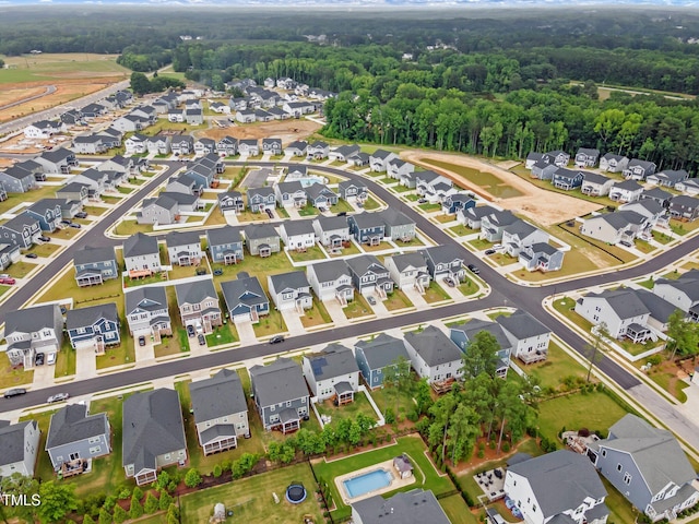 712 Emmer St, Rolesville, NC 27571 - aerial overview of property's location with nearby suburban area and a forest