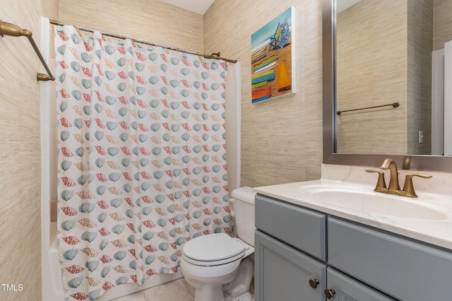 bathroom featuring toilet, vanity, tile patterned flooring, and shower / bath combination with curtain