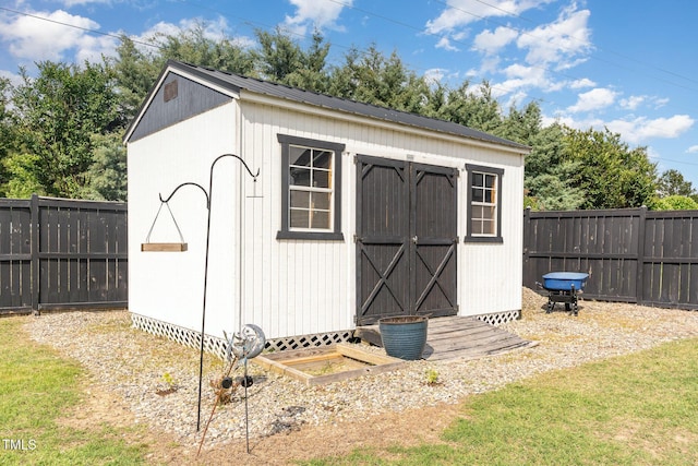 view of shed featuring a fenced backyard