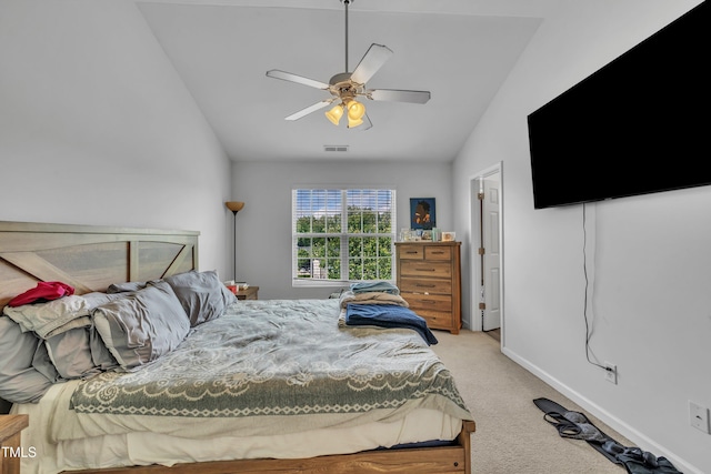bedroom featuring vaulted ceiling, light colored carpet, ceiling fan, and baseboards