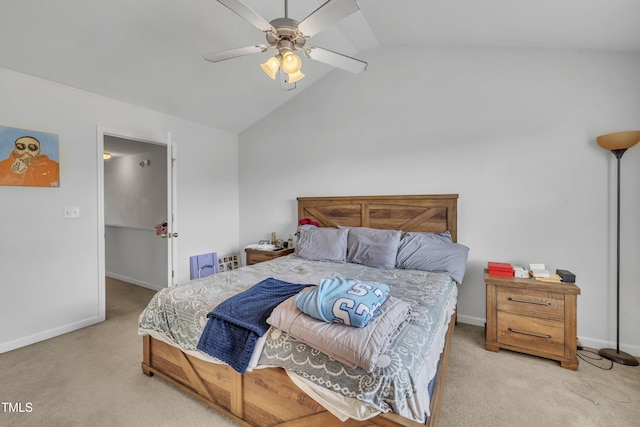 carpeted bedroom featuring lofted ceiling, baseboards, and ceiling fan