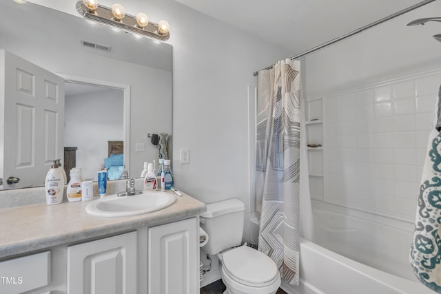 full bathroom featuring vanity, toilet, and shower / bath combo with shower curtain