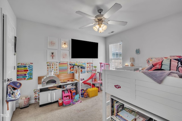 carpeted bedroom with ceiling fan