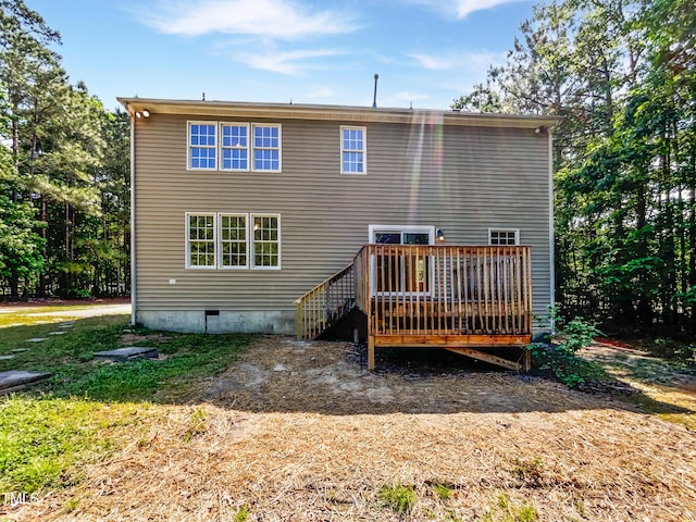 back of house featuring a wooden deck and crawl space