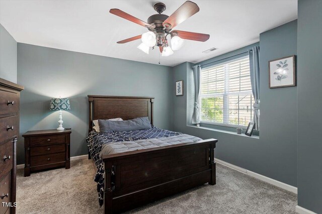 bedroom featuring carpet flooring, baseboards, and a ceiling fan