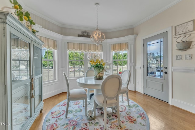296 Shoreline Dr, Princeton, NC 27569 - dining space featuring crown molding, light wood-type flooring, baseboards, and a notable chandelier