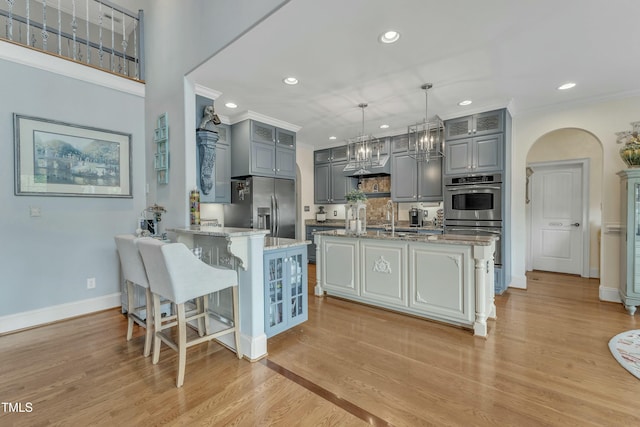 296 Shoreline Dr, Princeton, NC 27569 - kitchen with stainless steel appliances, a peninsula, gray cabinetry, and a sink